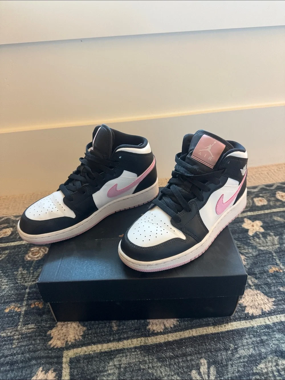 Nike Air Jordan 1 Mid High-Top Sneakers in Black, White & Pink